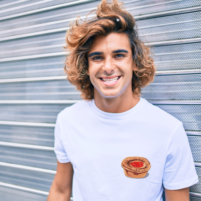 Man wearing a white t-shirt with printed meat pie design  standing in front of a metallic shutter.